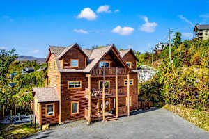 Spacious cabin retreat in Gatlinburg with stunning mountain views and plenty of parking. Enjoy multiple balconies, cozy interiors, & a peaceful setting just minutes from downtown attractions, dining, and entertainment. Perfect for a relaxing getaway!