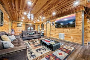 Cozy movie theater room with two sofa beds, a large TV, and a warm fireplace. Perfect for family movie nights or relaxing after a day of exploring. Enjoy ultimate comfort with beautiful views right from your seat!